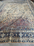Antique Kerman rug with beautifully abrashed field detail.