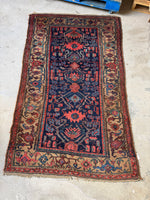 Persian Kurdish antique rug featuring tribal geometric patterns.