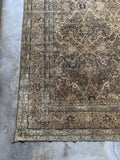 Corner view of border matching the field color, unusual for Kerman rugs.