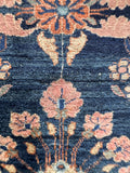 Antique Lilihan rug abrash texture close-up showing the subtle tonal shifts in the dark blue wool.