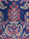 Antique Persian rug with pomegranate shaped vase forms and scrolling vines.