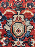 Persian Mahal rug field view highlighting abrashed reds and soft ivory motifs.