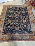 Heavily worn village Mahal rug woven with vegetable dyed wool.