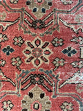 Detail of floral motifs in an antique Mahal village rug.