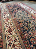 Hand knotted antique Persian runner with ivory border, emerald green, coral and teal accents.