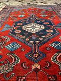 Close-up of a red and blue pattern with intricate designs.