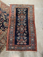 Vintage Malayer rug from the 1920s with warm tones and espresso brown details.