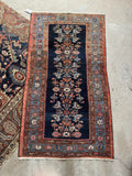 Vintage Malayer rug from the 1920s with warm tones and espresso brown details.