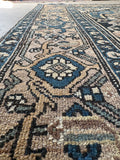 Antique Malayer rug detail showing intricate border motifs and weave.