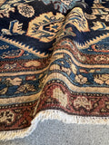 Secondary border detail on 1920s Malayer rug with traditional village motifs.