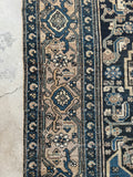 Antique village Malayer rug with detailed border and tribal design elements.