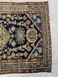 Another end view of Condition of 1920s antique Persian Malayer rug with even wool pile and clear motifs.