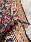 Antique Malayer runner fringe end showing the worn, historic edges and charming imperfections.
