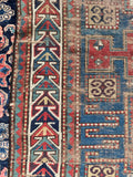 Vintage aqua blue tribal accent runner with time-earned antique wear and low pile texture.