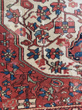 Worn antique Ferahan rug with mellowed vegetable dyes and old professional repairs.