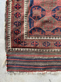 Antique Persian Baluch tribal rug woven during the first quarter of the 20th century.
