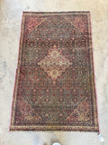 Full view of antique Persian Ferahan rug in all its beauty.