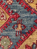 Antique 4x7 Persian area rug with vibrant aqua blue pole medallions, rare yellow ground color, and a close up of a female figure motif.