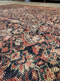 Antique Persian area rug. Circa 1900 Ferahan wool carpet with a navy ground, intricate floral artwork, and timeless heirloom craftsmanship.