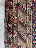 Heavy wool antique runner rug with colorful chain motif border bands.