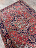 Vintage Northwest Persian Heriz rug diagonal view displaying crisp angular lines and rich color story.