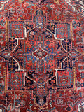 Vintage Persian Heriz area rug 8x11 with bold medallion and rich vegetable dyed wool.