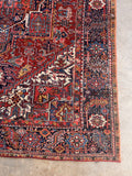 Antique Persian Heriz wool rug with sturdy construction and protected overcast edges.