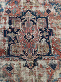 Closeup of Heriz rug central medallion with geometric detailing.