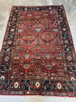 Full view of Northwest Persian Heriz rug showing linear rows of floral design.