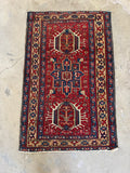 Small antique Heriz rug perfect for an entryway, kitchen, or bathroom.
