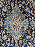 1930s Antique Persian Kashan rug with navy blue field and powder blue medallion.