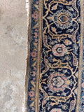 Authentic 1930s Persian Kashan rug with refined floral border.