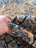 Fine weave detail of hand knotted Persian Kerman rug.