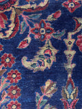 Hand knotted Persian Lilihan rug with flexible weave and aged wool surface.