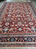 Vintage Persian Mahal rug featuring midnight blue borders and abrashed motifs.