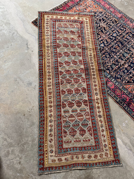 Antique Persian Mahal runner from the 1920s, handwoven with vegetable-dyed wool.