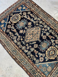 Antique Malayer village rug circa 1920s with detailed allover design against an inky navy blue ground.