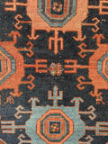 Detail of central medallion design on antique Malayer rug with natural dyes.
