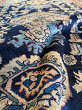 Close up of soft wool pile on antique Malayer rug showing sheen and even texture.