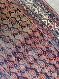 Worn antique Persian scatter rug with vegetable dyed wool, low pile and farmhouse character.