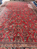 Heavy pile Persian rug measuring approximately 10x18, showcasing exceptional craftsmanship and dense knots.