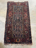Vintage Malayer rug with low pile, vegetable dyed wool, and worn in character.