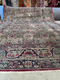Sand field antique Kerman area rug measuring 4 foot 5 inches by 6 foot 5 inches.