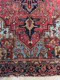 Antique Persian rug 7’ x 9’9 with angular art and classic Heriz pattern in saturated natural dyes.