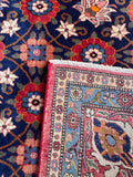 Antique wool Persian carpet corner fold demonstrating heavy, stout backing.