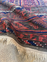 Edge detail highlighting handwoven construction and natural fringe.