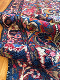 Vintage Dargazin rug with brilliant vegetable dyed wool and dark framed border design.