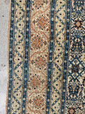Traditional Persian rug floral border detailed view of main border band with classic repeating flower chain.