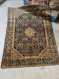 Full view of antique Persian Herati rug with fish motifs in corner spandrels.