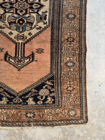 Corner view of 1920s Persian rug in amazing condition with soothing color story.